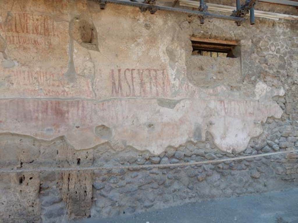 IX.12.7 Pompeii. December 2007. Graffiti between IX.12.6 and IX.12.7
Found here was CIL IV 7910, beneath that CIL IV 7912, both partly conserved and visible. See Varone, A. and Stefani, G., 2009. Titulorum Pictorum Pompeianorum, Rome: L’erma di Bretschneider (p.451)
According to Epigraphik-Datenbank Clauss/Slaby (See www.manfredclauss.de), these read as -
L(ucium)  Popidium  Iuvenem 
aed(ilem)  Crescens  scio  te  cupere       [CIL IV 7910]
Ti(berium)  Claudium  Claudian[um         [CIL IV 7912]
