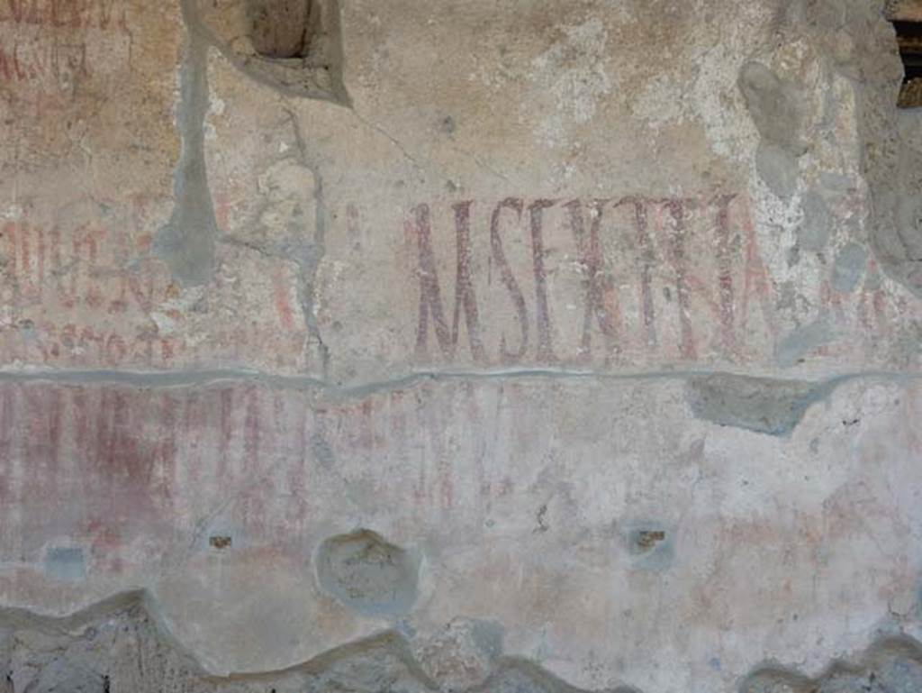 IX.12.7 Pompeii. May 2017. Detail of graffiti on west side of window opening between IX.12.6 and IX.12.7. Photo courtesy of Buzz Ferebee.