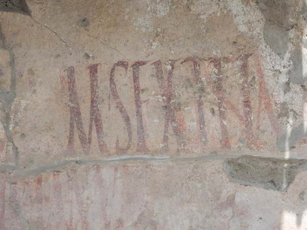IX.12.7, Pompeii, May 2018. Detail of graffiti on west side of window. Photo courtesy of Buzz Ferebee.