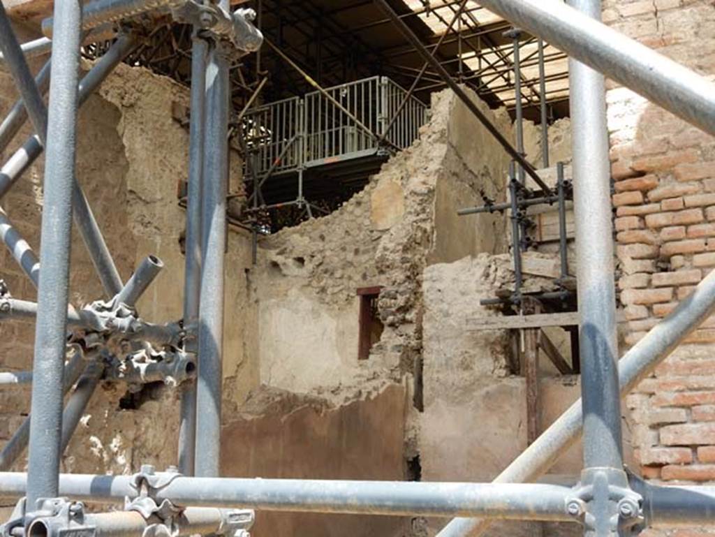 IX.12.7 Pompeii, May 2018. Looking towards west wall of shop-room 1, from entrance doorway.
At the rear of the west wall are the upper walls of room “c2” of IX.12.6. Photo courtesy of Buzz Ferebee.