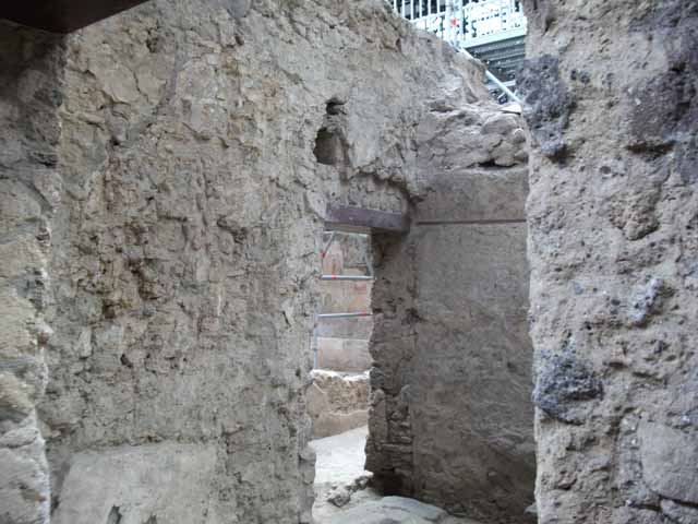 IX.12.8 Pompeii. December 2006. West wall of stable, with view across stable to triclinium of IX.12.6.
