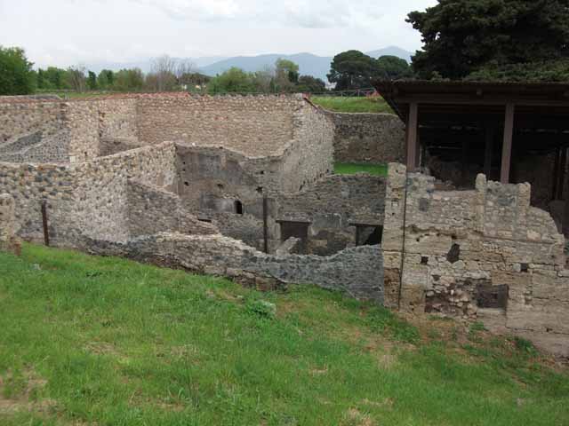 IX.14.b Pompeii, May 2010. Looking east at outside wall, with blocked entrance doorway. This led to the room on the left side of the picture..