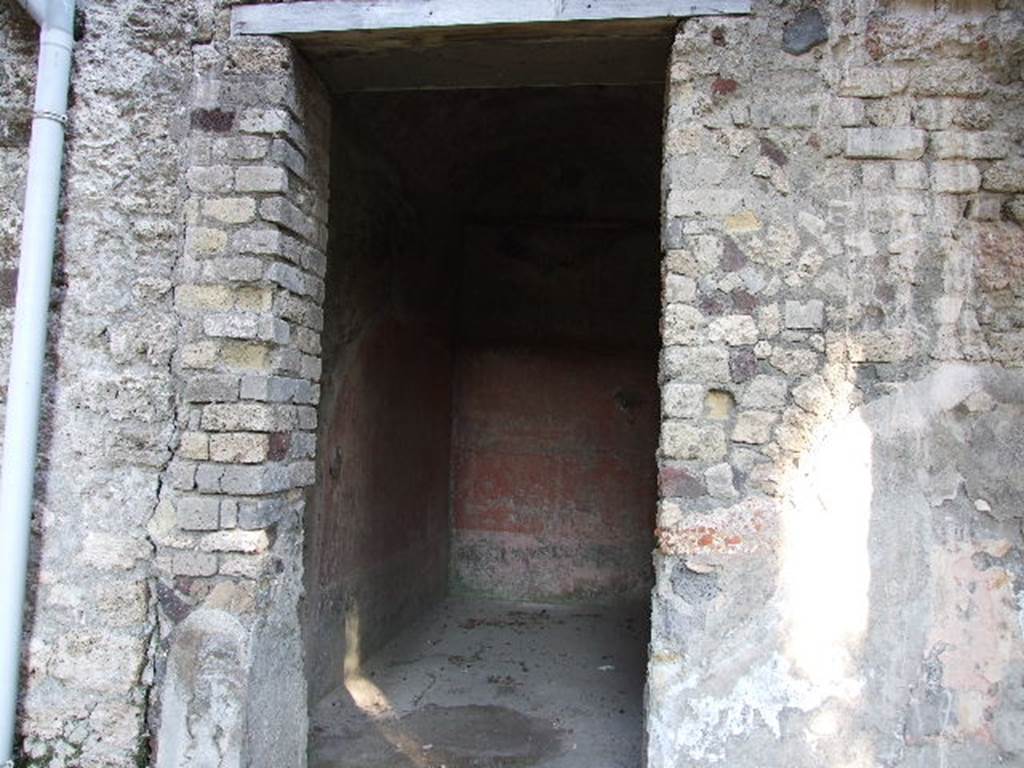 HGW24 Pompeii. December 2006.
Looking east into doorway to another one of the richly decorated living rooms on the eastern side of the garden. 
(Fontaine, room 5,8).

