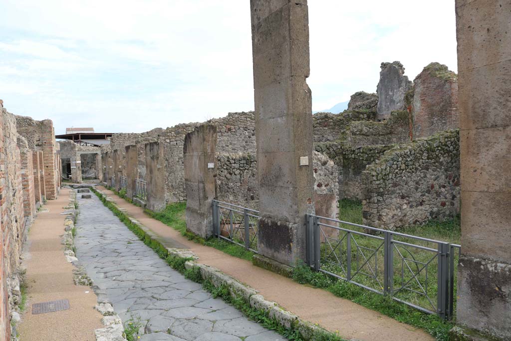 Via degli Augustali, Pompeii. December 2018. Looking east between VII.2, on left, and VII.12.8, on right. Photo courtesy of Aude Durand.