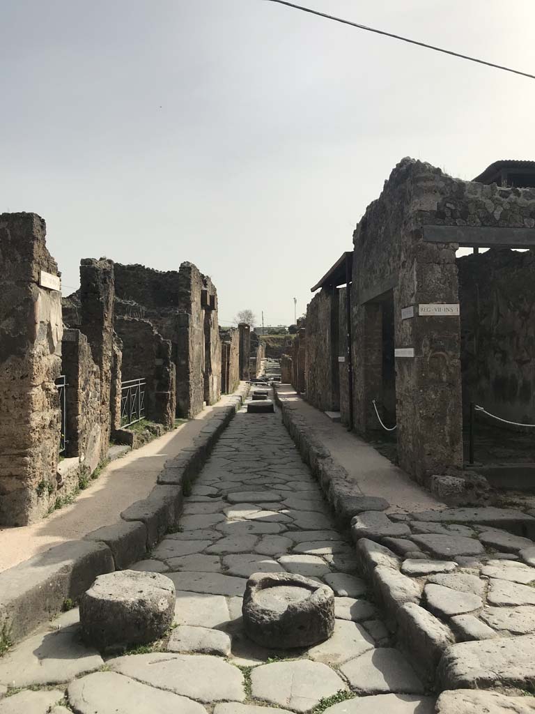 Via degli Augustali, April 2019. Looking east between VII.2 and VII.1, from near VII.2.47, on left.
Photo courtesy of Rick Bauer.
