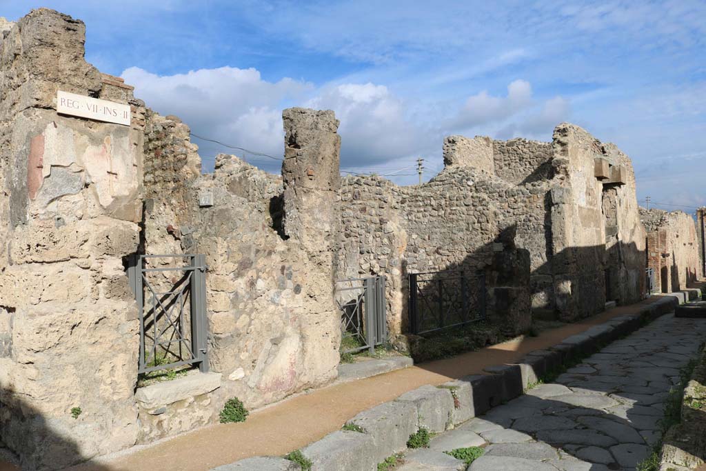 Via degli Augustali, north side, Pompeii, December 2018. Looking east from near VII.2.47, on left. Photo courtesy of Aude Durand.