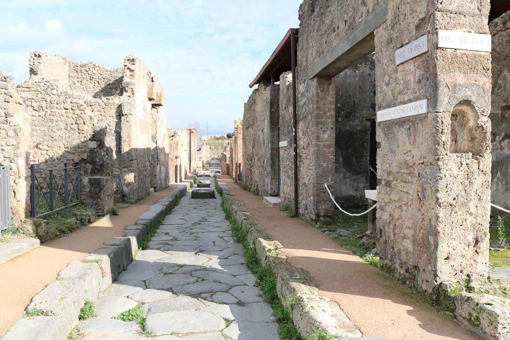 Via degli Augustali, Pompeii. December 2018. 
Looking east between VII.2, on left, and VII.1.41, on right. Photo courtesy of Aude Durand.
