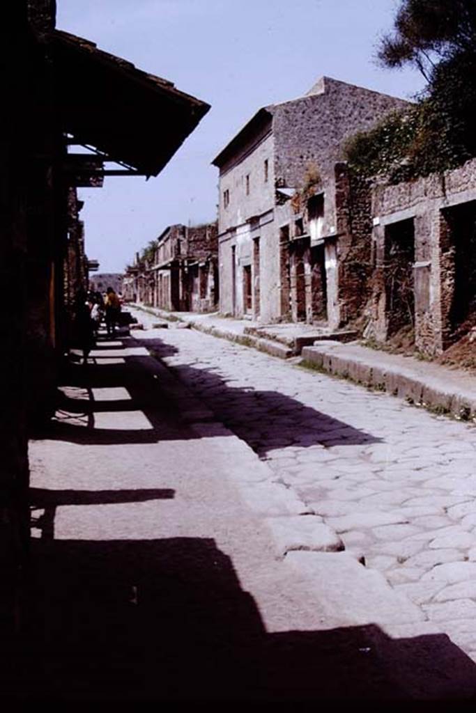 Via dell’Abbondanza, Pompeii. 1972. Looking west between I.11 and III.1. 
Photo by Stanley A. Jashemski. 
Source: The Wilhelmina and Stanley A. Jashemski archive in the University of Maryland Library, Special Collections (See collection page) and made available under the Creative Commons Attribution-Non Commercial License v.4. See Licence and use details. J72f0402
