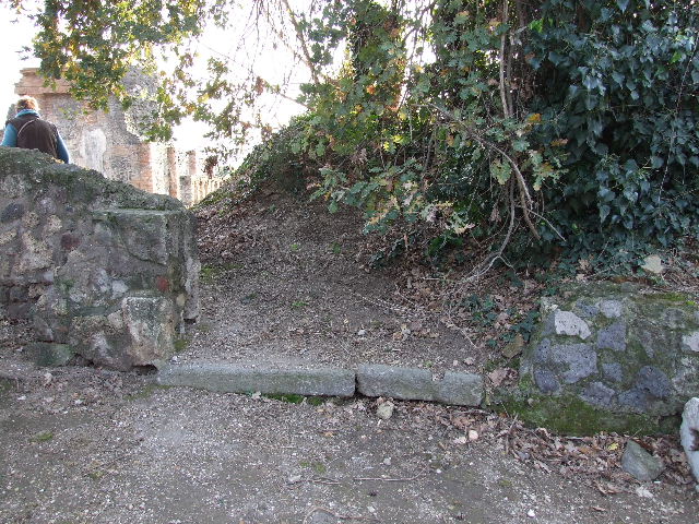 HGW05 entrance in centre.  The stone wall on left has been built across the Via Pomeriale.