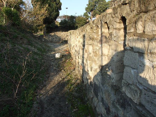 The site of the Via Pomeriale is in centre with HGW4a to right.  The site of street altar on wall was on the left.  See Mazois 