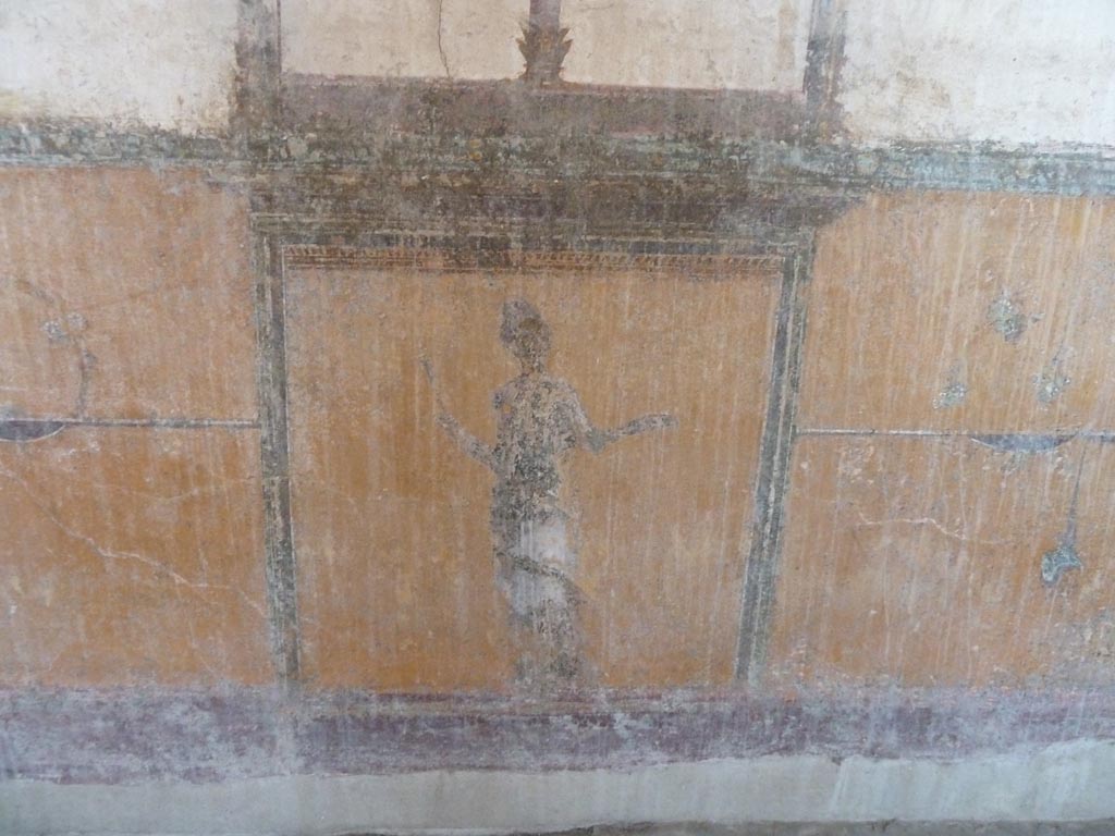 Stabiae, Villa Arianna, September 2015. Room 12, lower wall and zoccolo (dado) of south wall with painted figure in panel.