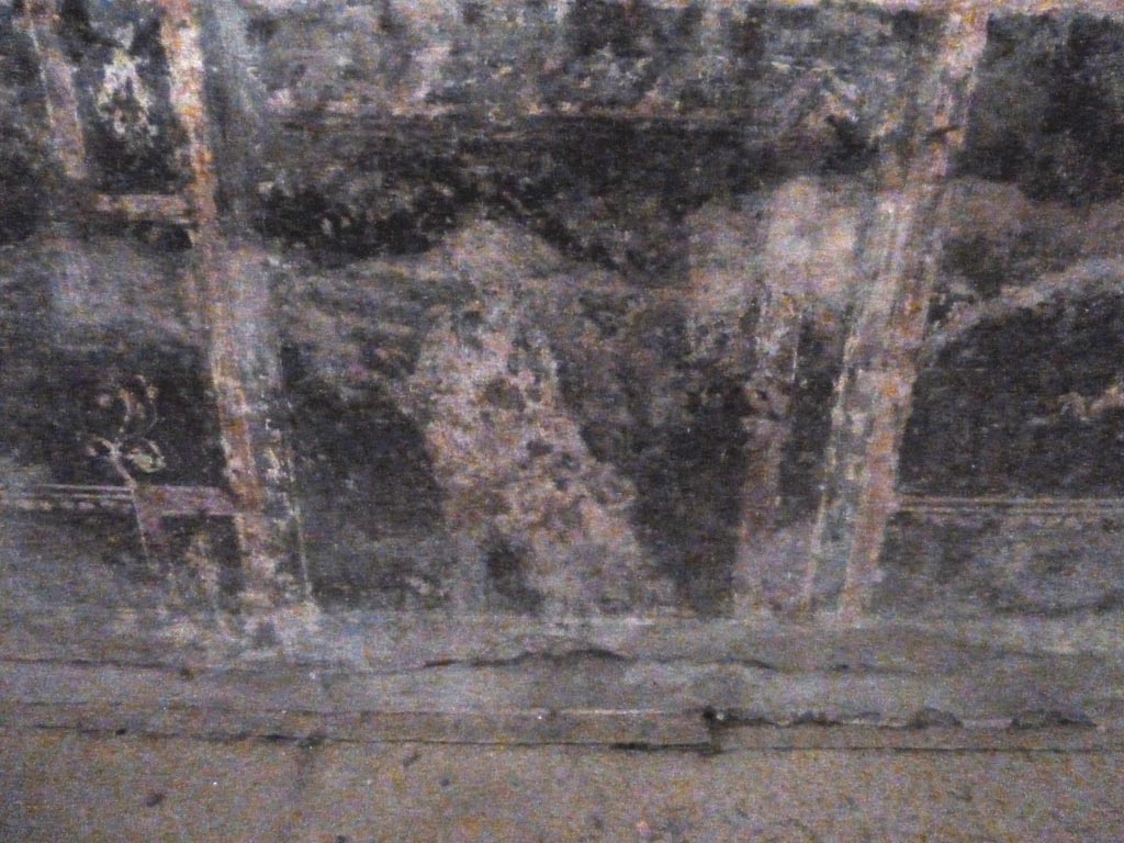 Stabiae, Villa Arianna, September 2015. Room 5, painted figure on black painted zoccolo from west end of south wall.