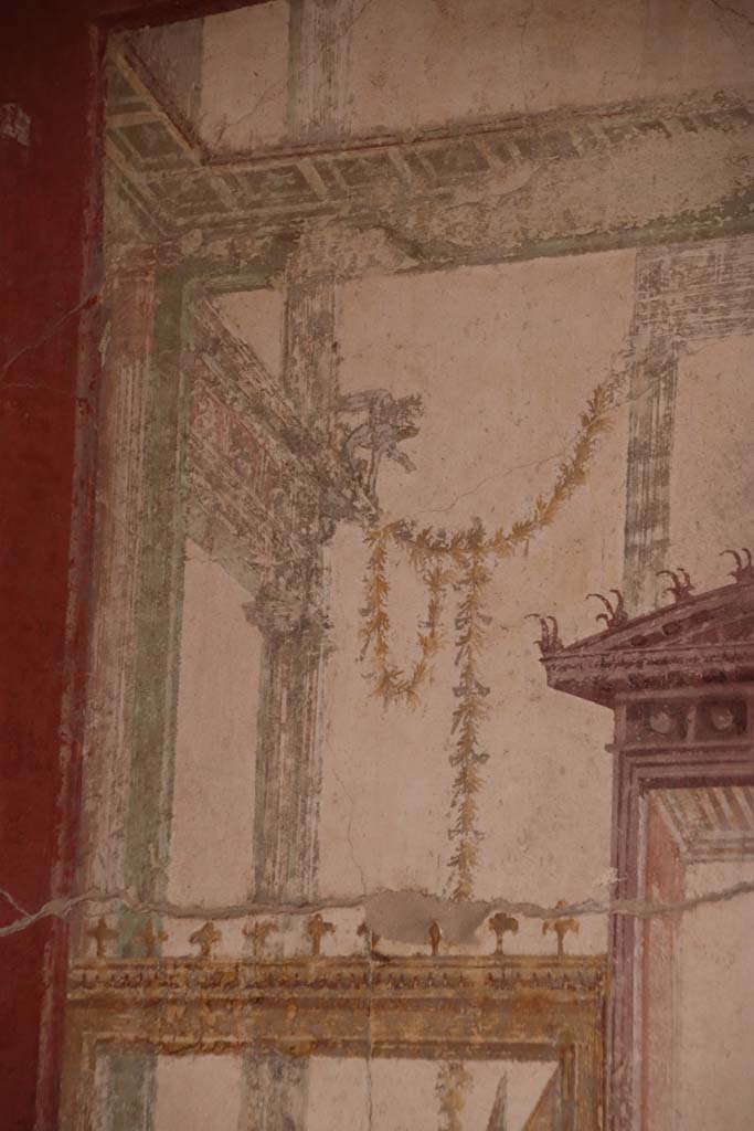 Stabiae, Villa Arianna, October 2020. 
Room 7, detail on upper painted panel above figure, at south end of west wall. Photo courtesy of Klaus Heese.
