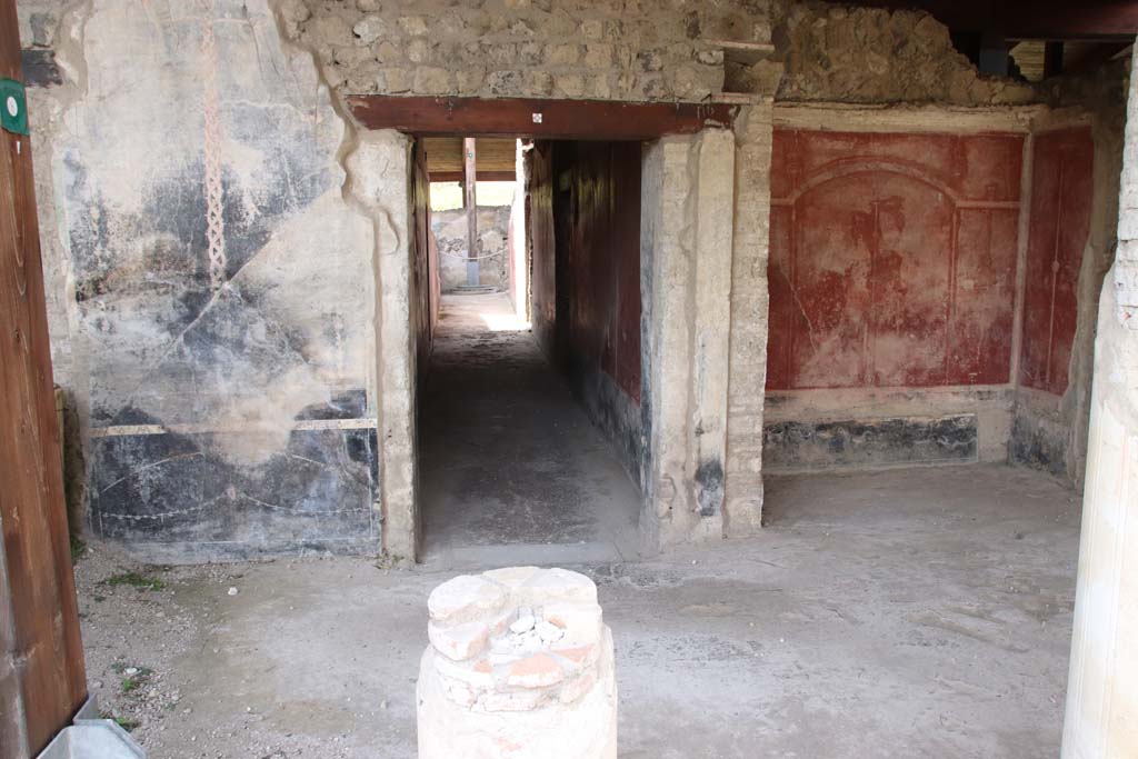 Stabiae, Villa Arianna, September 2021. 
W. 22, west portico of peristyle, looking west towards remains of painted decoration at sides of doorway to corridor W.27. 
Photo courtesy of Klaus Heese.

