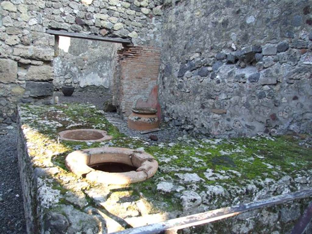 VI.14.36 Pompeii. December 2007. Looking east across two-sided counter with two dolia set in it.