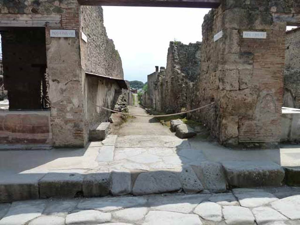 Pompeii Street Altar at I.8.1. May 2010. Street altar on east side of Vicolo dellEfebo. Looking south from Via dellAbbondanza. In 1912 the Vicolo dellEfebo was excavated for a short distance only. On the west side of insula I.8 (the east side of the Vicolo dell Efebo) a painting of a long serpent was found. It was winding in coils towards what they believed might be a central altar with a second serpent on the other side. This would mean a painting of around 10 metres in length if this were found to be the case when it was fully excavated. To the left the wall had painted panels (then no longer visible), divided in the middle by a thin garland, and under these was a long seat covered with cocciopesto. See Notizie degli Scavi di Antichit, 1912, p. 184.
