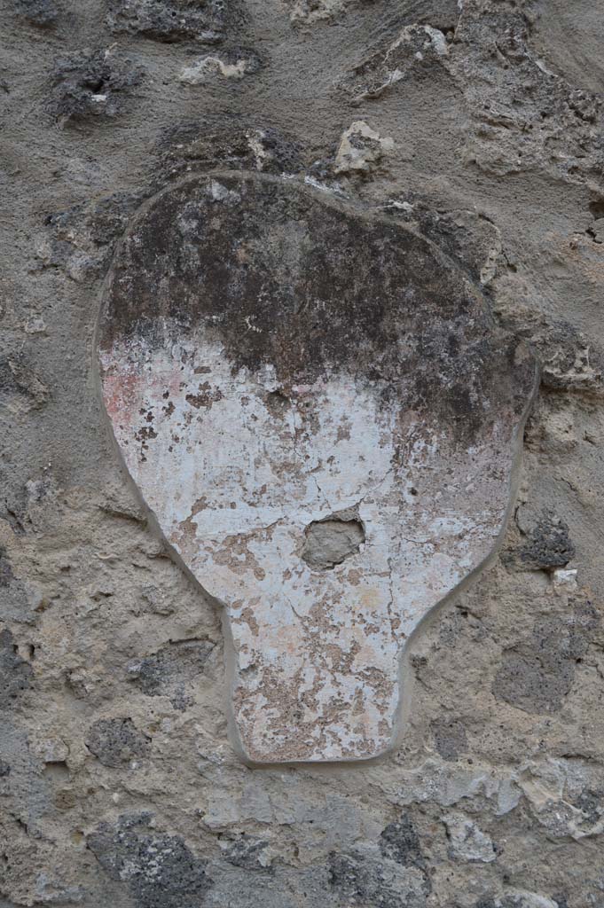 I.11.7 Pompeii. October 2018. Detail of remaining stucco on wall to south of street altar.
Foto Taylor Lauritsen, ERC Grant 681269 DCOR.
