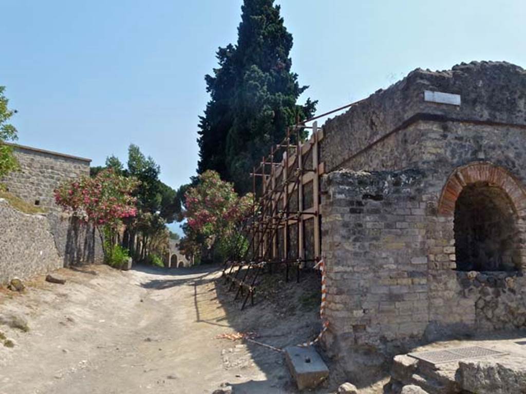 Pompeii II.4.7a. June 2012. Looking south along Vicolo dell’ Anfiteatro, and street shrine on north-east corner of II.4, on right. Photo courtesy of Michael Binns.
