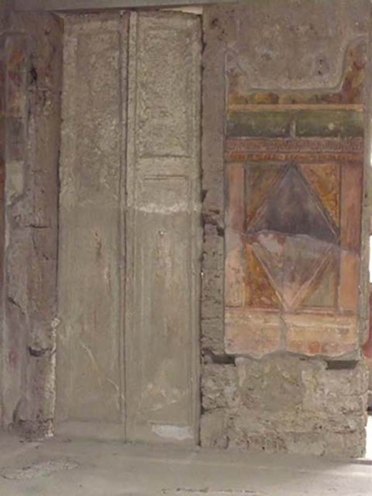 Villa of Mysteries, Pompeii. May 2012. Room 64, cast of doors in north-east corner.
Photo courtesy of Buzz Ferebee.
