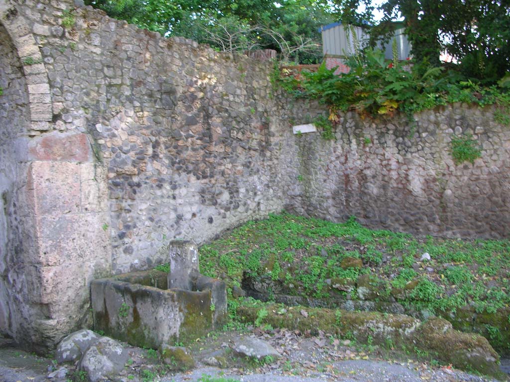 Porta Stabia, Pompeii. May 2010. 
Looking towards north-west side of gate, with fountain and course of drain. Photo courtesy of Ivo van der Graaff.
