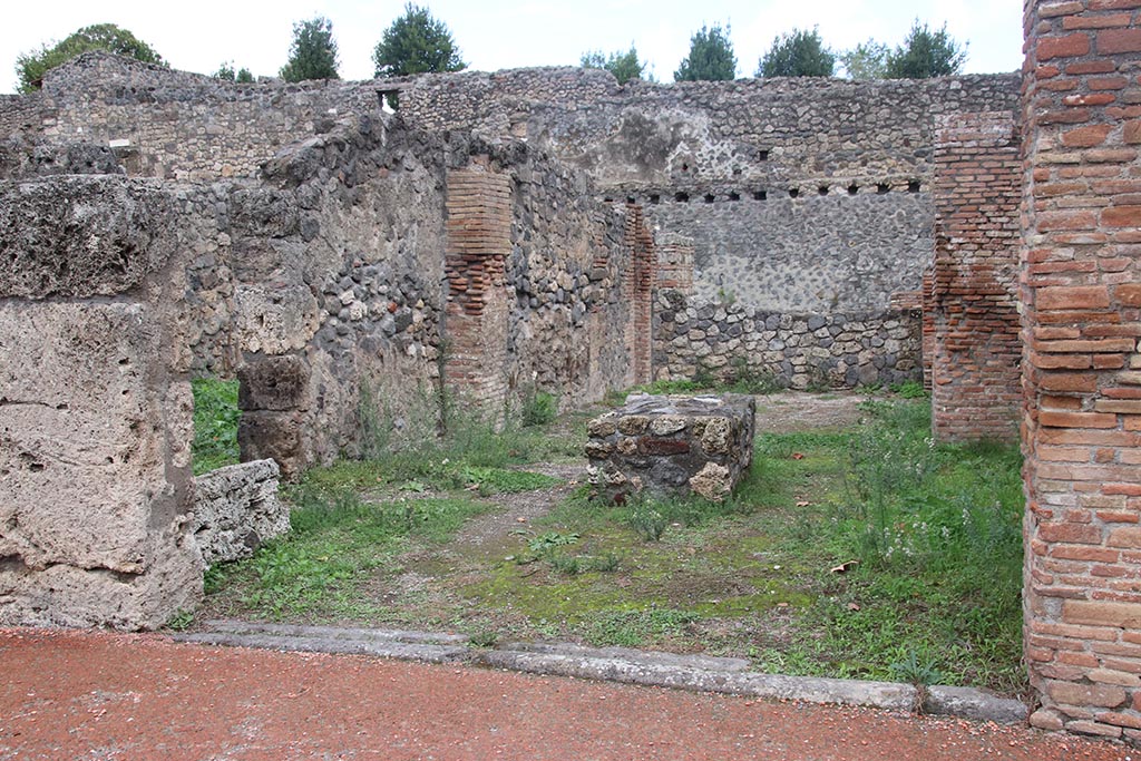 I.1.4 Pompeii. October 2024. Looking east across shop-room towards rear room. Photo courtesy of Klaus Heese.