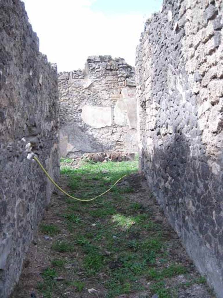 I.2.24 Pompeii. September 2010. Looking north through entrance fauces or corridor towards atrium.Photo courtesy of Drew Baker.
According to Fiorelli, the use of this edifice had been named from a graffito, found in the atrium. He described - after the entrance corridor there was an area, the roof held up by two columns, with an aperture through which the water flowed to an impluvium near the facing wall, on which one could read - 
C . NONIVS . LORICA
P . INSTVLEIVS NEDYMVS LIBRARI . QVI . C……
L . AELIVS . CYDINVS          SVNT . HIC .SIN ……
ACILIVS . CEDRVS                APPVLEI . ADIVTOR . ET…..
See Pappalardo, U., 2001. La Descrizione di Pompei per Giuseppe Fiorelli (1875). Napoli: Massa Editore. (p.37)
According to Della Corte, here flanked by seats was the entrance to a house of irregular plan spacious and commodious enough, noted for its sacred painting.Here was installed a workshop of copyists, some of whom are shown in the following epigraph, painted in the courtyard at the front (see Note 5 on page 274) –
C. Nonius Lorica, P. Instuleius Nedymus,
     L. Aelius Cydinus, Acilius Cedrus, library qui…sunt hic sine….
                                Appulei Adiutor(is)?.....   (CIL IV 3376)
Other names were also found graffitoed in the house, and it was not possible to know if they too were copyists - C. Siccius, Nicanor e Restitutus.  See Della Corte, M., 1965.  Case ed Abitanti di Pompei. Napoli: Fausto Fiorentino. (p.274)
According to Garcia y Garcia, the edifice here had been identified as the seat of a possible association of public scribes, or of a typing agency as we would call it today. Fiorelli called it Officina libraria after an important inscription (CIL IV 3376) found on the wall of the atrium, near to the impluvium:  This would be where the « copyists » or amanuenses bound or transcribed their books.  These copyists were not many, but were certainly active participants in the electoral propaganda, as can be deduced from the defaced inscription on the right of the entrance number I.2.23, nearby: (Libr) ARI ROG(ant). (CIL IV 3368)  See Garcia y Garcia, L., 2005. Pupils, Teachers and Schools in Pompeii. Roma: Bardi editore. (p.119)
According to Epigraphik-Datenbank Clauss/Slaby (See www.manfredclauss.de), these read –
C(aius) Nonius Lorica 
P(ublius) Instuleius Nedymus 
L(ucius) Aelius Cydinus 
Acilius Cedrus 
/ Librari qui C[3] 
sunt hic sine [3] 
Appulei adiutor et II[        (CIL IV 3376)
[3] Sabinum 
[3]ari rog(at)      (CIL IV 3368).

