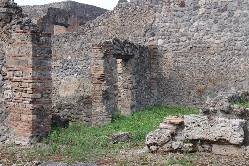 I.2.31 Pompeii. October 2024. Looking north towards entrance doorway into rear room of bar at I.2.1, on left.
The other doorway, in the west wall, leads into another rear room of I.2.1. Photo courtesy of Klaus Heese.
