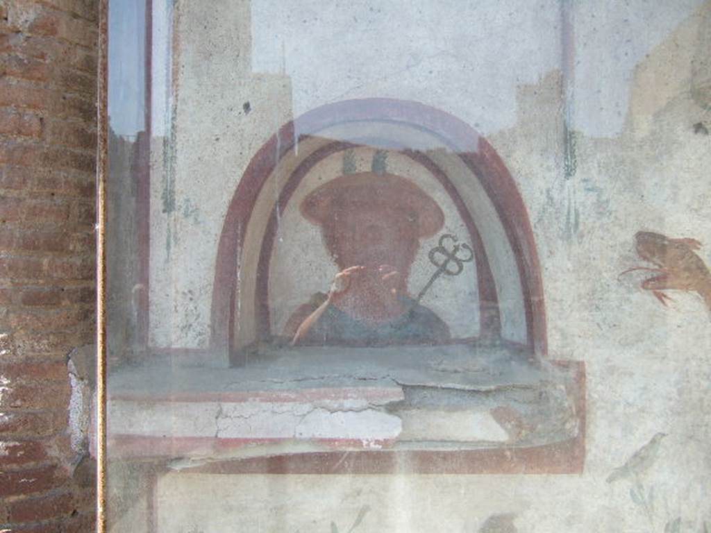 I.6.2 Pompeii. May 2006.  Niche with painting of Mercury, on the lararium.  