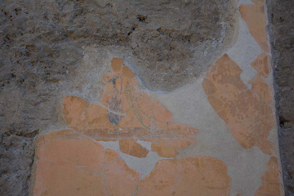 I.7.1 Pompeii. October 2019. Detail of painted vignette of shield and vase on yellow panel, south of centre of east wall of atrium. 
Foto Annette Haug, ERC Grant 681269 DCOR.



