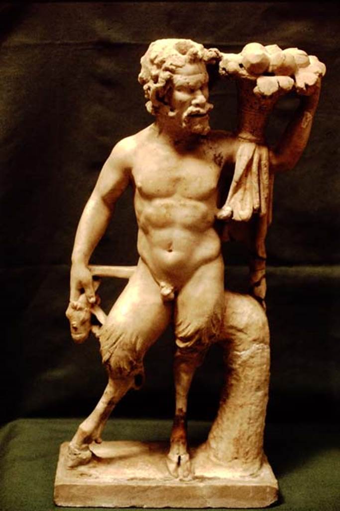 I.7.11 Pompeii, 1978. Statuette of a goat-footed pan. Photo by Stanley A. Jashemski.   
Source: The Wilhelmina and Stanley A. Jashemski archive in the University of Maryland Library, Special Collections (See collection page) and made available under the Creative Commons Attribution-Non Commercial License v.4. See Licence and use details. J78f0148
