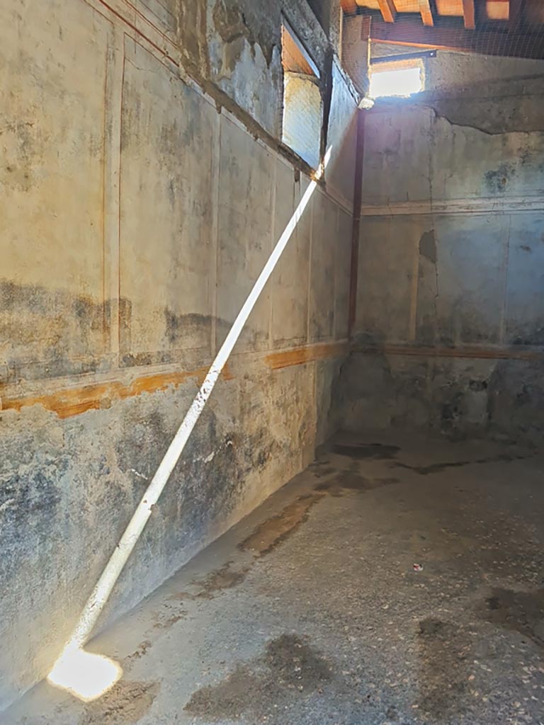 I.7.11 Pompeii. March 2024. 
Looking south along east wall in triclinium in the south-east corner of the atrium. Photo courtesy of Giuseppe Ciaramella.
