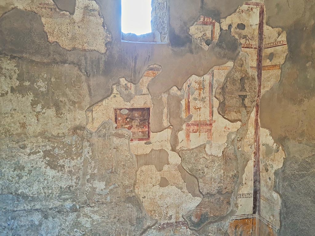 I.7.11 Pompeii. March 2024. Looking towards east wall with central painting. Photo courtesy of Giuseppe Ciaramella.
