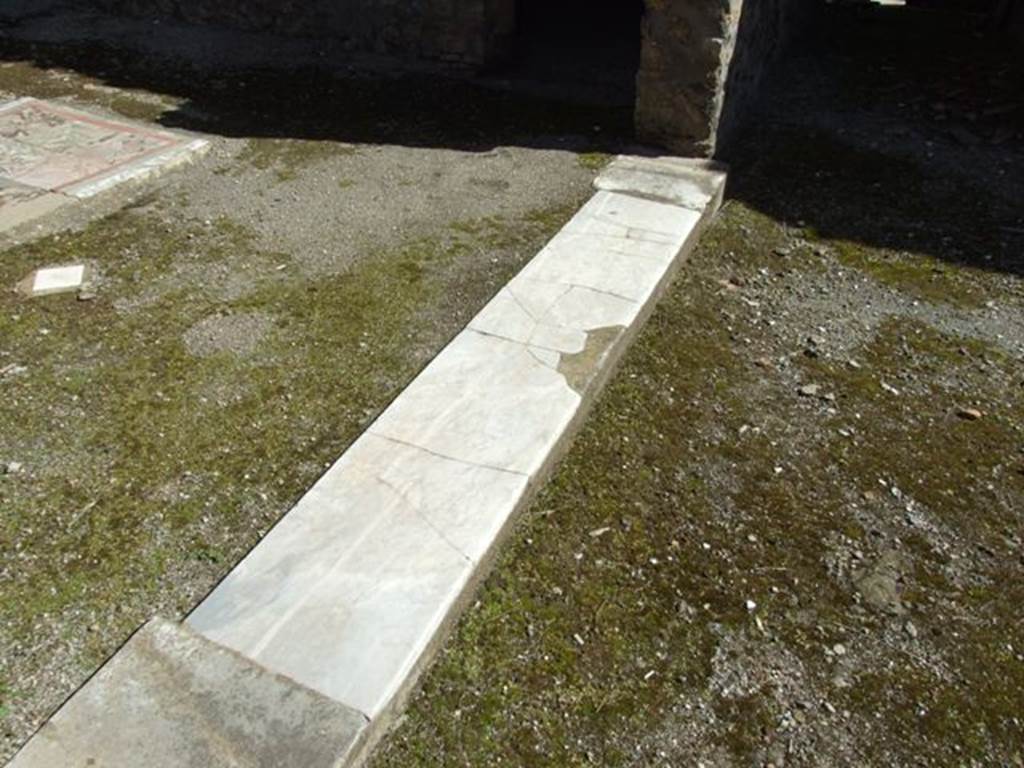 I.8.9 Pompeii.  March 2009.  Room 2.  Marble threshold dividing room 2 and room 1.