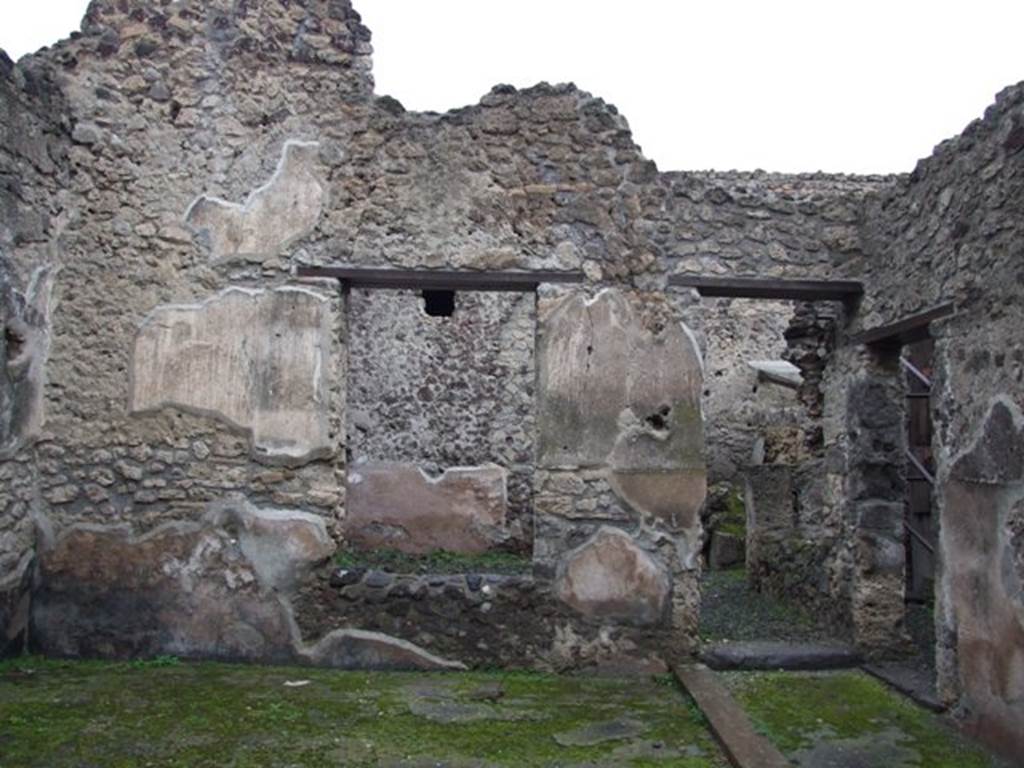 I.8.14 Pompeii. December 2007. Room 2, looking north across atrium. 
To the north of the atrium (2) follows the small courtyard (7) in which most of the amphorae were found; from it, passing into the small room (8), you enter to the West the kitchen, with adjoining latrine (10) and (11) and, to the East, into room (9), the only one that preserves more substantial remains of pictorial decoration of 4th style.
Guardando a nord attraverso l'atrio 2. 
Segue al Nord dell'atrio (2) il cortiletto (7) nel quale si rinvenne la maggior parte delle anfore; da esso, superando il piccolo ambiente (8), si accede ad Ovest alla cucina, con annessa latrina (10) e (11) e, ad Est all’ambiente (9), l’unico che conserva più consistenti resti di decorazione pittorica di IV stile.
See/Vedi Carratelli, G. P., 1990-2003. Pompei: Pitture e Mosaici: Vol. I. Roma: Istituto della enciclopedia italiana, p. 834-5.
