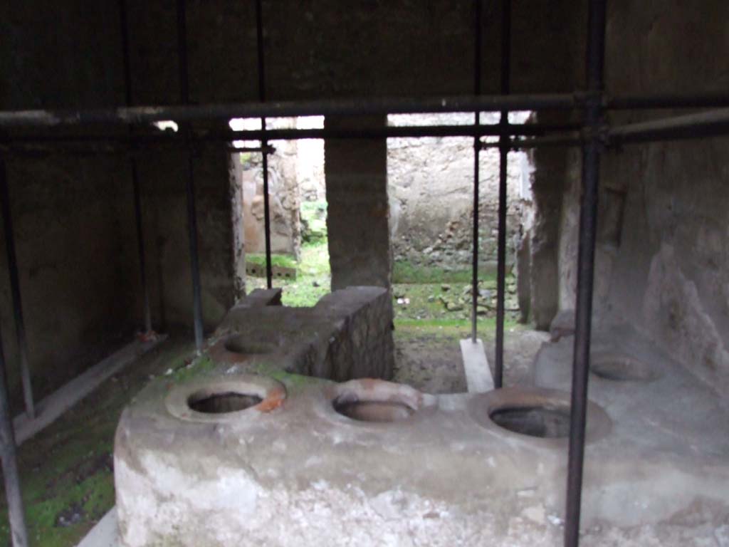 I.8.15 Pompeii. December 2007. Looking north across shop-room, with counter. 