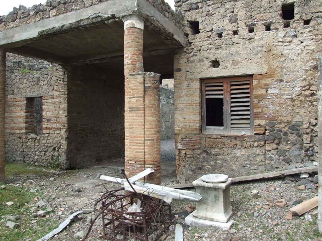 I.9.3 Pompeii. March 2009. Room 6, north portico of garden area. Site where the statue of a small boy with a dove was found in 1952.  