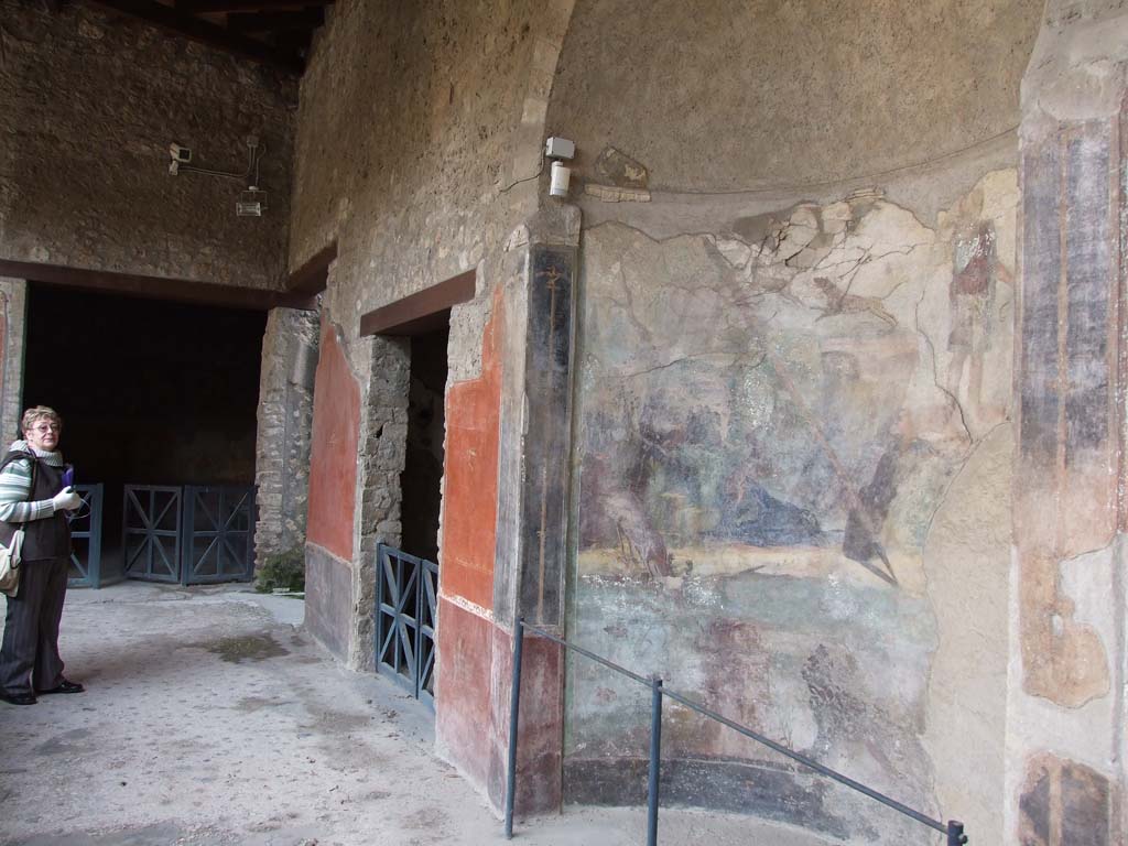 I.10.4 Pompeii. December 2006. Looking east along south portico, with alcove 22, and doorways to rooms 21 and 19. 