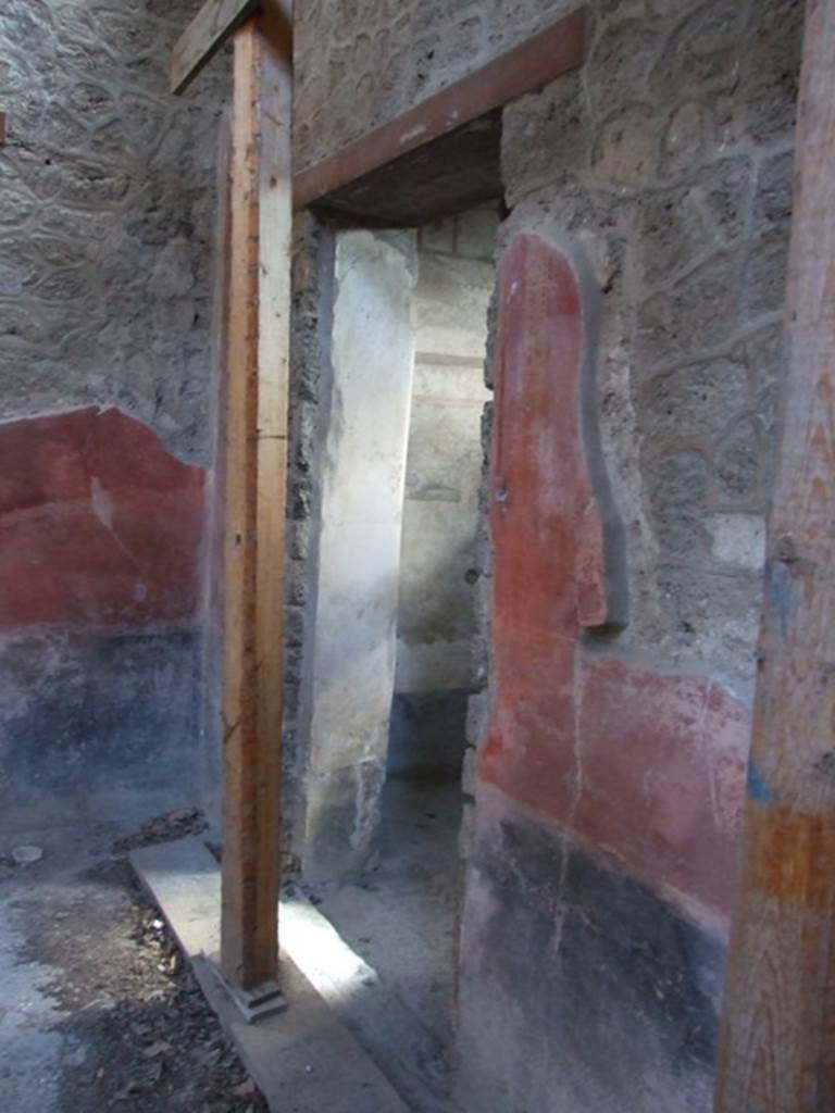 I.10.11 Pompeii. March 2009. 
Room 2, looking towards doorway to room 7, in south-east corner of atrium.  
