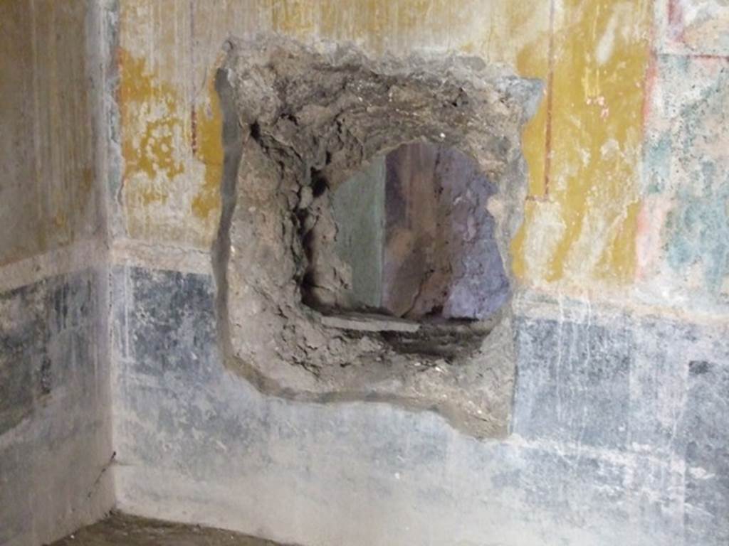 I.10.11 Pompeii.  March 2009.  Room 8.  Triclinium.  West wall.  Ancient hole in wall.