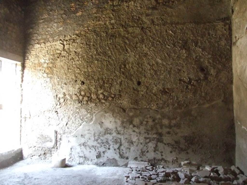 I.10.11 Pompeii. March 2009. Room 2, north-west corner of atrium. Looking north into linked shop at I.10.10.