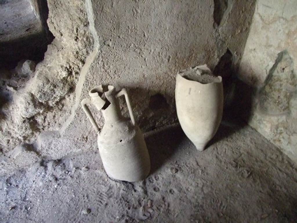 I.10.11 Pompeii.  March 2009.  Room 17.  East wall.  Remains of two amphorae.