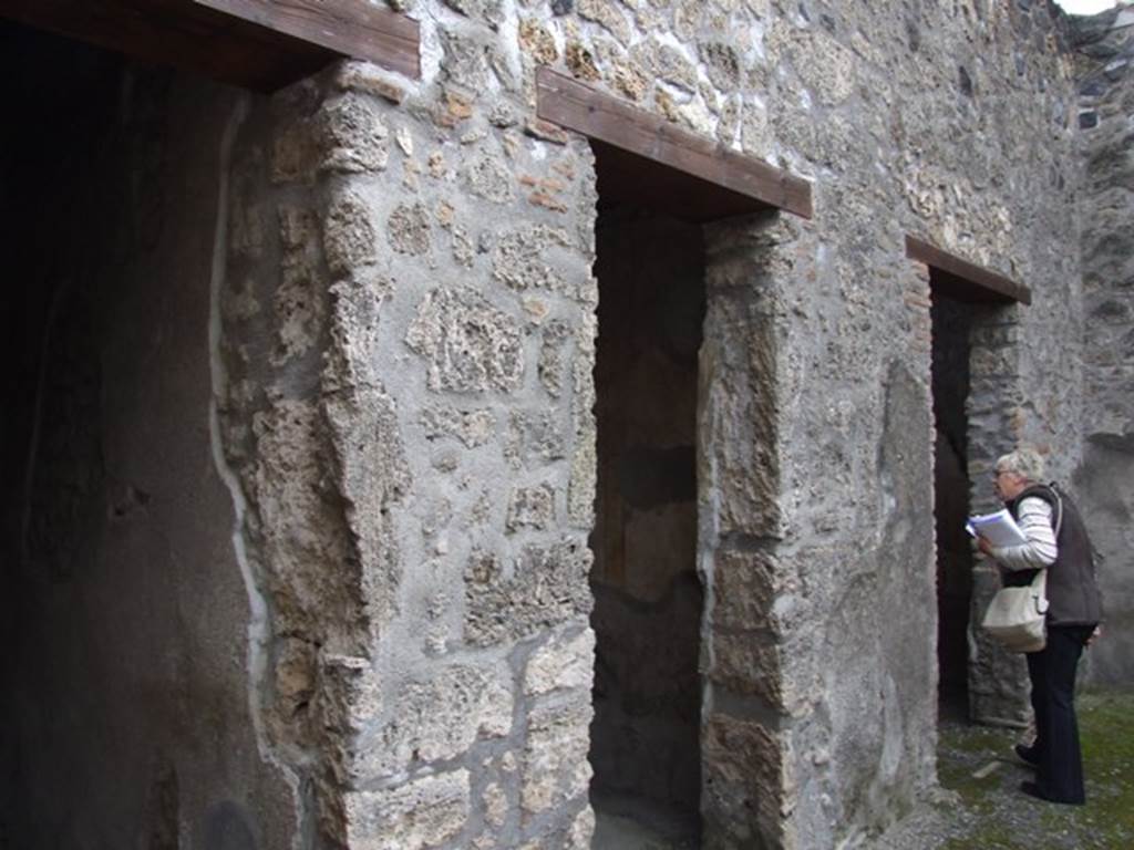 I.11.6 Pompeii. March 2009. East wall of atrium, with doors to rooms, 2,3 and 4