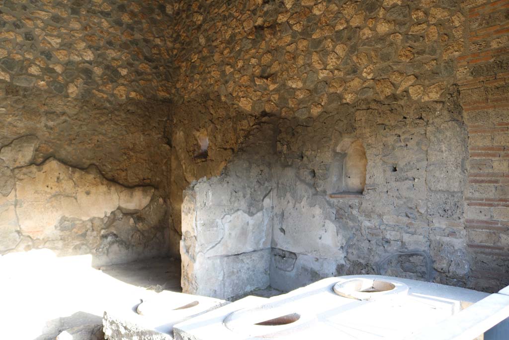 I.14.15 Pompeii. December 2018. Looking north-east across counter towards rear room. Photo courtesy of Aude Durand.
