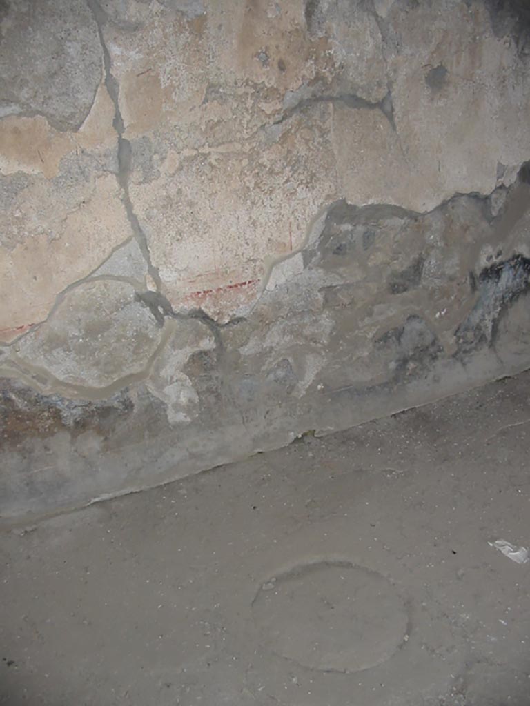 I.14.15 Pompeii. May 2003. 
Detail of north wall and floor of rear room behind counter. Photo courtesy of Nicolas Monteix.
