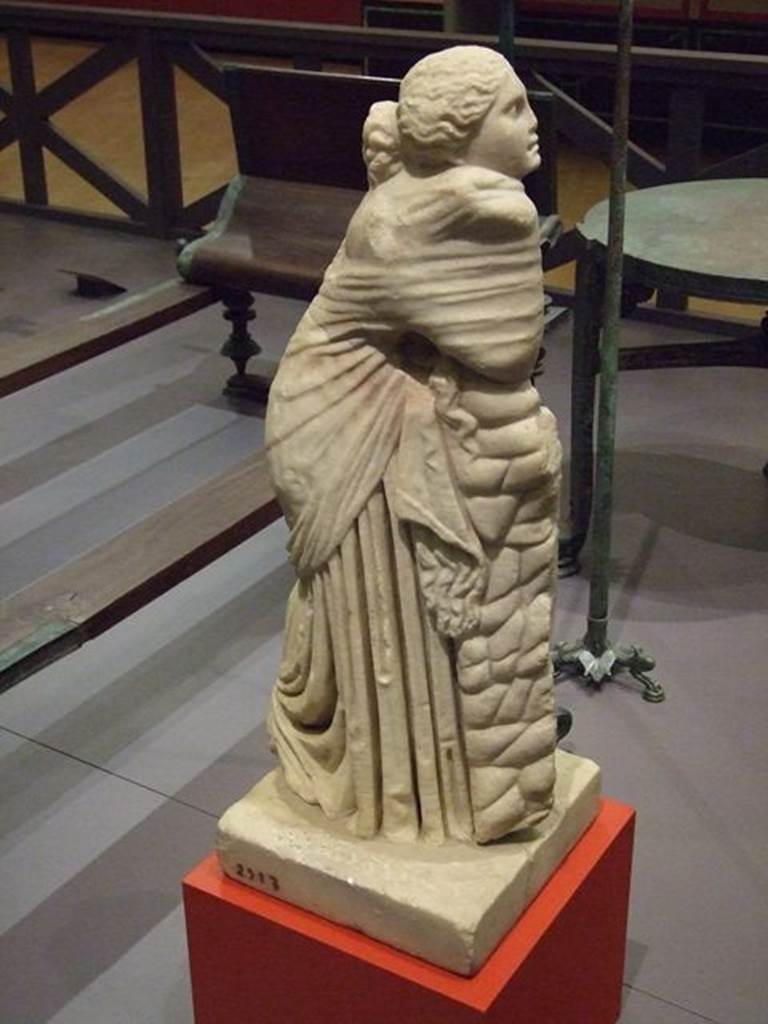 II.2.2 Pompeii. Room “i”. Statue of the muse Polyhymnia. SAP 2917. There were nine goddesses who presided over the arts and sciences.  Polyhymnia was the muse of lyric poetry and singing.  The statue was one of several on bases between the pillars of the portico. Photographed at “A Day in Pompeii” exhibition at Melbourne Museum.  September 2009. Jashemski describes the two surviving statues as, one of Polyhymnia (SAP 2917) and the second of Mnemosyne (SAP 2909). The names on her photographs however are reversed. See Jashemski, W. F., 1993. The Gardens of Pompeii, Volume II: Appendices. New York: Caratzas. (p. 80-1, Figs 84-85).