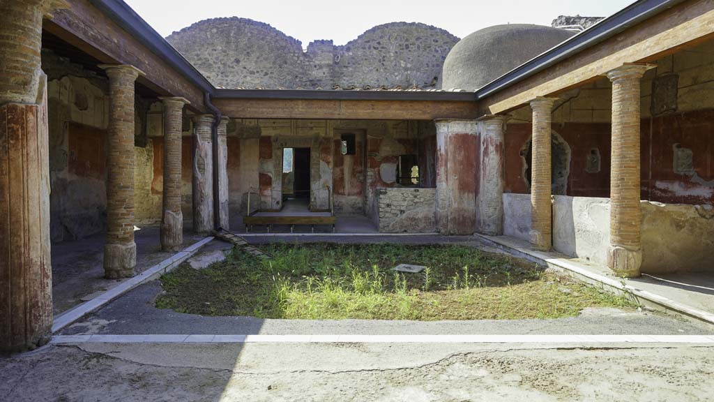 II.4.6 Pompeii. 1972. Looking towards entrances of II.4.6, centre, and  II.4.5 and II.4.4.  Photo by Stanley A. Jashemski. 
Source: The Wilhelmina and Stanley A. Jashemski archive in the University of Maryland Library, Special Collections (See collection page) and made available under the Creative Commons Attribution-Non Commercial License v.4. See Licence and use details. J72f0511
