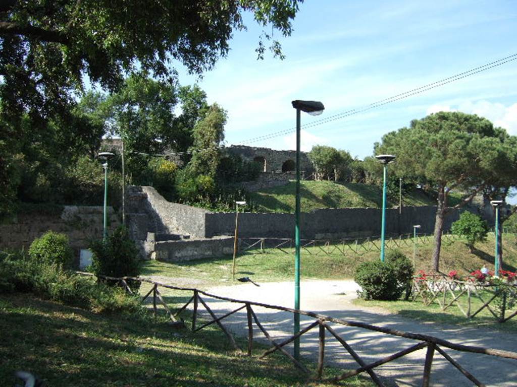 II.6 Pompeii. May 2006. Amphitheatre and Tower IV, looking north.