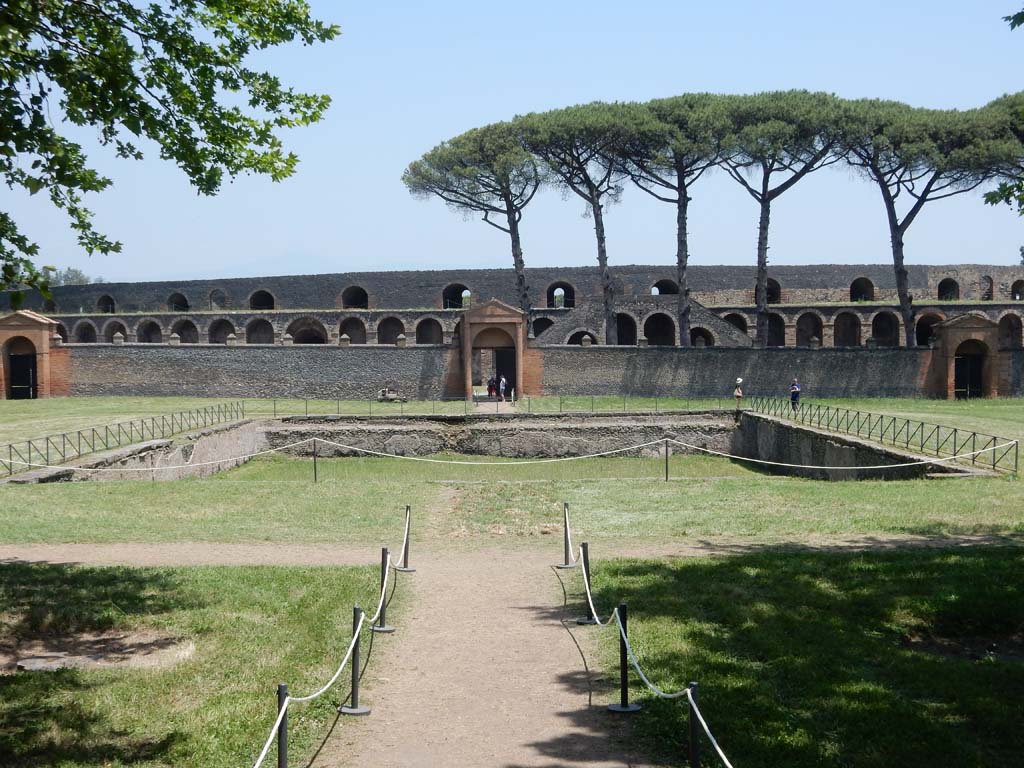 II.7.3 Pompeii. June 2019. Looking east across pool in Palestra, with entrance at II.7.4, left of centre, and II.7.3, right of centre.
Photo courtesy of Buzz Ferebee.
