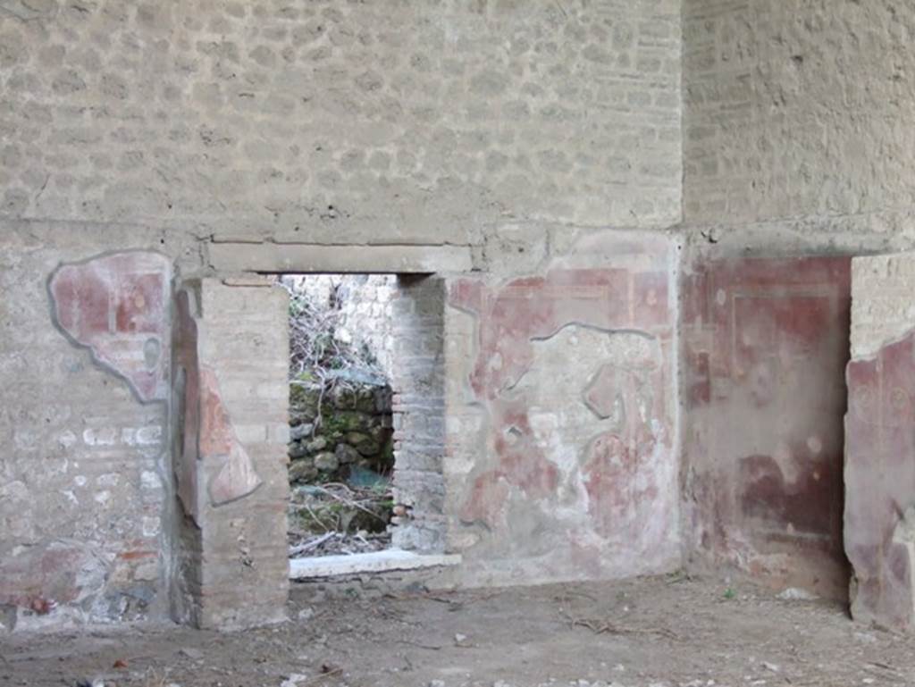 III.3.6 Pompeii.  Schola Armaturarum Iuventutis Pompeianae.  December 2007.  Brick pillars and painted plaster and door to rear rooms on east end of North wall.