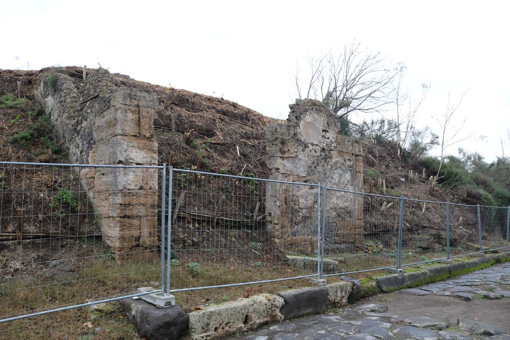 III.7.1, Pompeii. December 2018. 
On the immediate left is the unexcavated roadway with the doorway of III.7.1 next, on the right. Looking east along insula.
Photo courtesy of Aude Durand.
